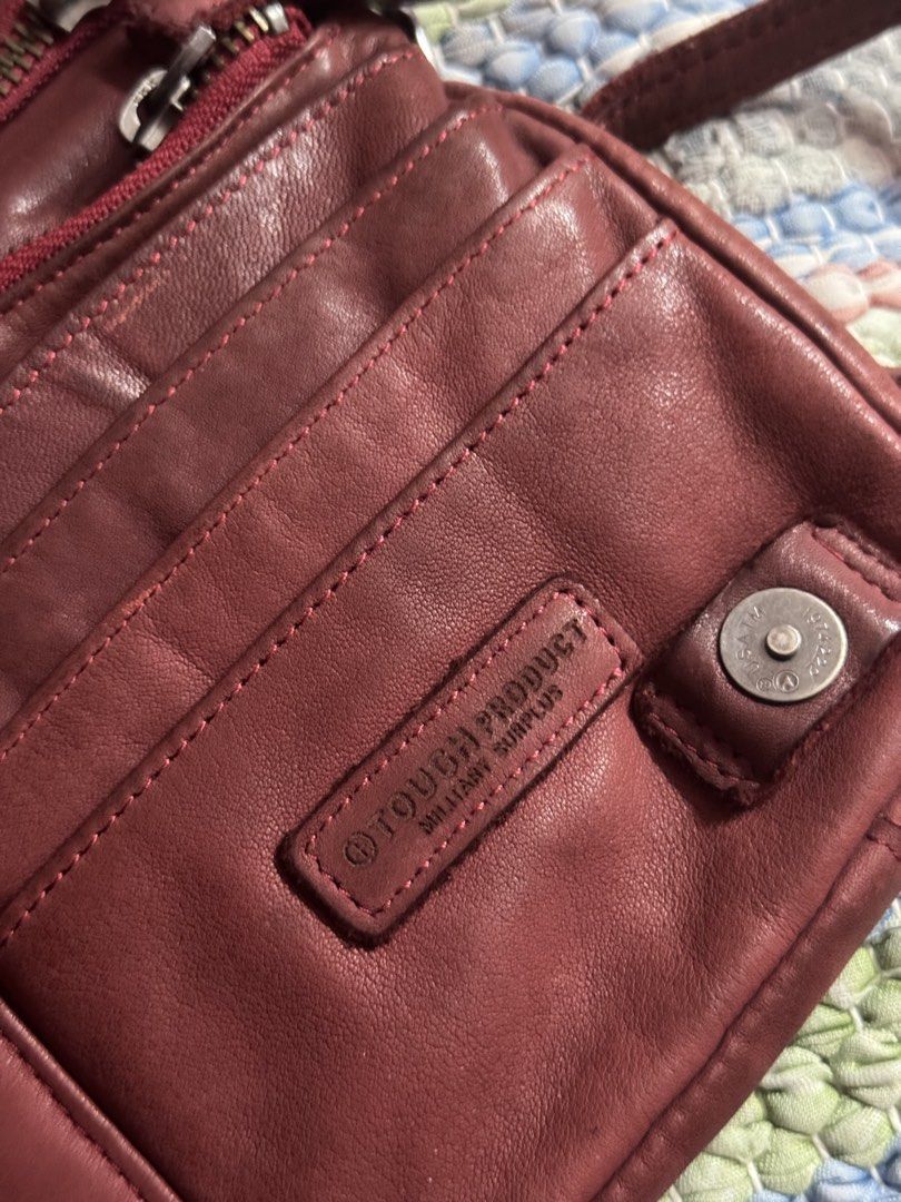 Tough Jeansmith Leather Crossbody Bag (Category: Cross-body Bags) located in Makati City. Submitted by vinsanity41546 (Listing ID 1448445950, Image 3). Description: - Genuine Tough Jeansmith leather crossbody bag - Multiple zippered compartments for secure storage - Interior card slots for organization - Adjustable strap for comfortable wear - Stylish worn-in leather look - Ideal for everyday use.