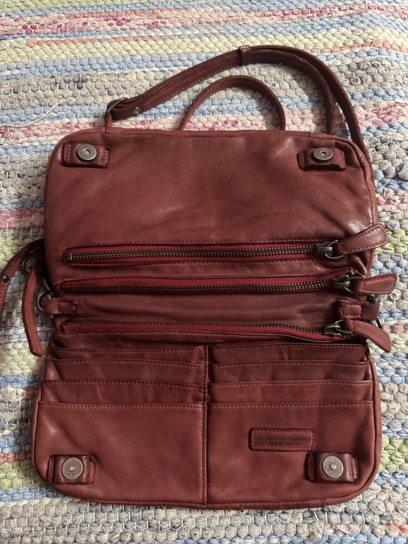 Tough Jeansmith Leather Crossbody Bag (Category: Cross-body Bags) located in Makati City. Submitted by vinsanity41546 (Listing ID 1448445950, Image 2). Description: - Genuine Tough Jeansmith leather crossbody bag - Multiple zippered compartments for secure storage - Interior card slots for organization - Adjustable strap for comfortable wear - Stylish worn-in leather look - Ideal for everyday use.