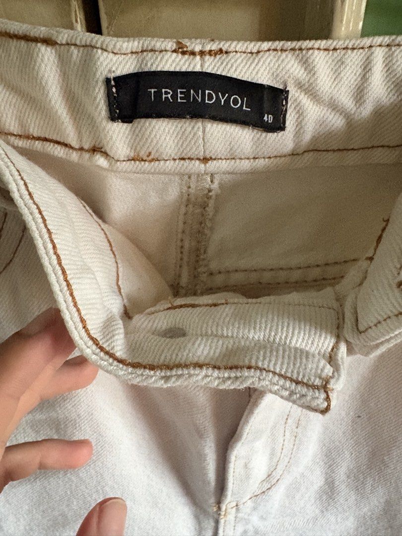 Trendyol Off White High Waisted Mom Jeans (Category: Jeans) located in Manila. Submitted by localdepop (Listing ID 1448314458, Image 3). Description: - Trendyol off-white mom jeans - High-waisted fit - Fits 25-26 inch waistline - 38 inch length - Classic five-pocket design - Zip fly with button closure - Contrasting brown stitching - Small dark mark on front of right leg (see last photo) 📍Cainta, Rizal Rfs: gained weight 🚛: Lalamove.