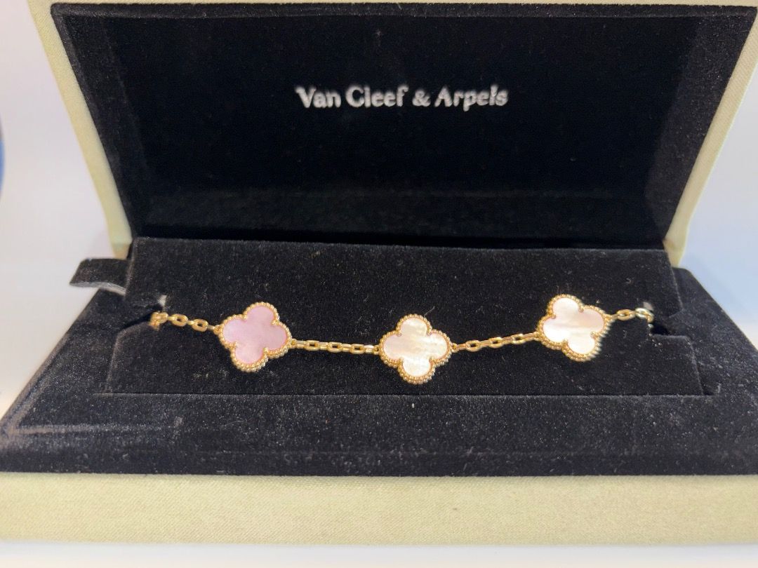 Van Cleef & Arpels Sweet Alhambra Bracelet (Category: Bracelets) located in Caloocan City. Submitted by cg031 (Listing ID 1448420359, Image 3). Description: - Authentic Van Cleef & Arpels Sweet Alhambra bracelet - Iconic four-leaf clover motif - Features mother of pearl and pink stone - Crafted in gold - Includes original box - A classic and elegant piece.
