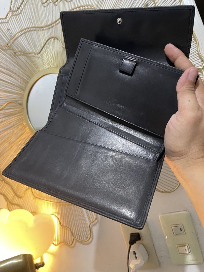 Vintage Coach Black Leather Trifold Wallet (Category: Wallets & Card holders) located in Urdaneta. Submitted by picky_picker (Listing ID 1448460668, Image 3). Description: - Brand: Coach -Complete with Cheque Book wallet insert - Material: Black Leather - Style: Trifold Wallet - Features: - Multiple card slots - Coin compartment - Zip pocket - Condition: Shows some signs of wear on the inside leather, but has plenty of life left. - Includes: Deta