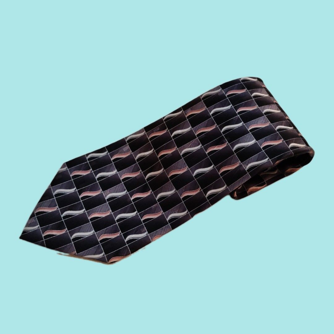 Vintage Pierre Cardin Silk Tie - Geometric Pattern (Category: Ties) located in Dinalupihan. Submitted by senkustuff (Listing ID 1448372759, Image 1). Description: - Classic Pierre Cardin tie - Made from 100% silk - Features a dark geometric pattern - Wavy lines in shades of grey, pink, and white - Ideal for formal occasions or adding sophistication to any outfit - Looks sharp and stylish.