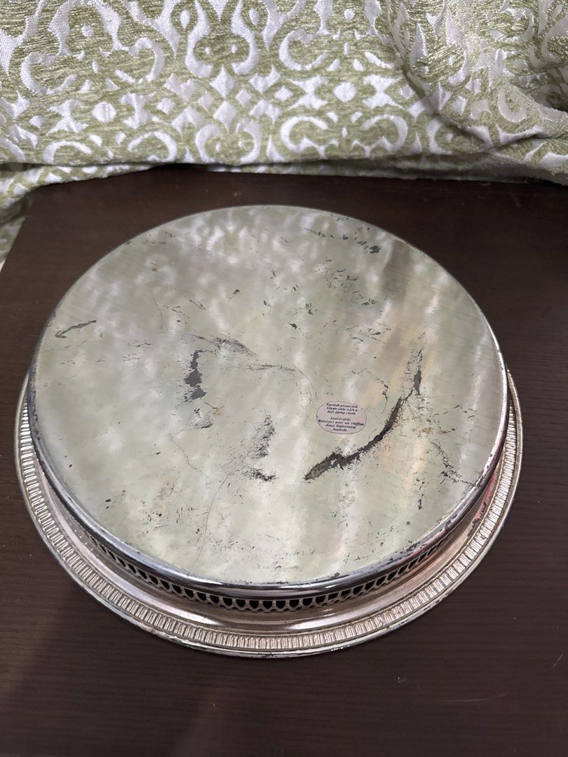 Vintage Silver Plated Serving Tray with Ornate Design (Category: Other Kitchenware & Tableware) located in Quezon City. Submitted by elektra0111 (Listing ID 1448479975, Image 3). Description: - Vintage round serving tray - Silver plated with intricate embossed floral and scroll pattern - Decorative rim with cut-out details - Ideal for serving drinks or as a decorative accent piece - diameter 29cm outside / 25 cm inner .