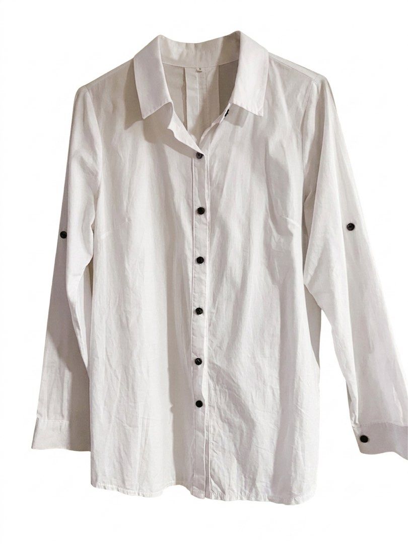 On Sale!!! White Button-Up Long Sleeves Polo with Black Buttons (Category: Shirts) located in Lipa City. Submitted by emscorner (Listing ID 1448315625, Image 1). Description: - Classic white button-up long sleeves - Size: S - Black button front closure - Unique button detail on the back - Roll-up sleeve tabs included - Perfect for both casual and formal occasions.