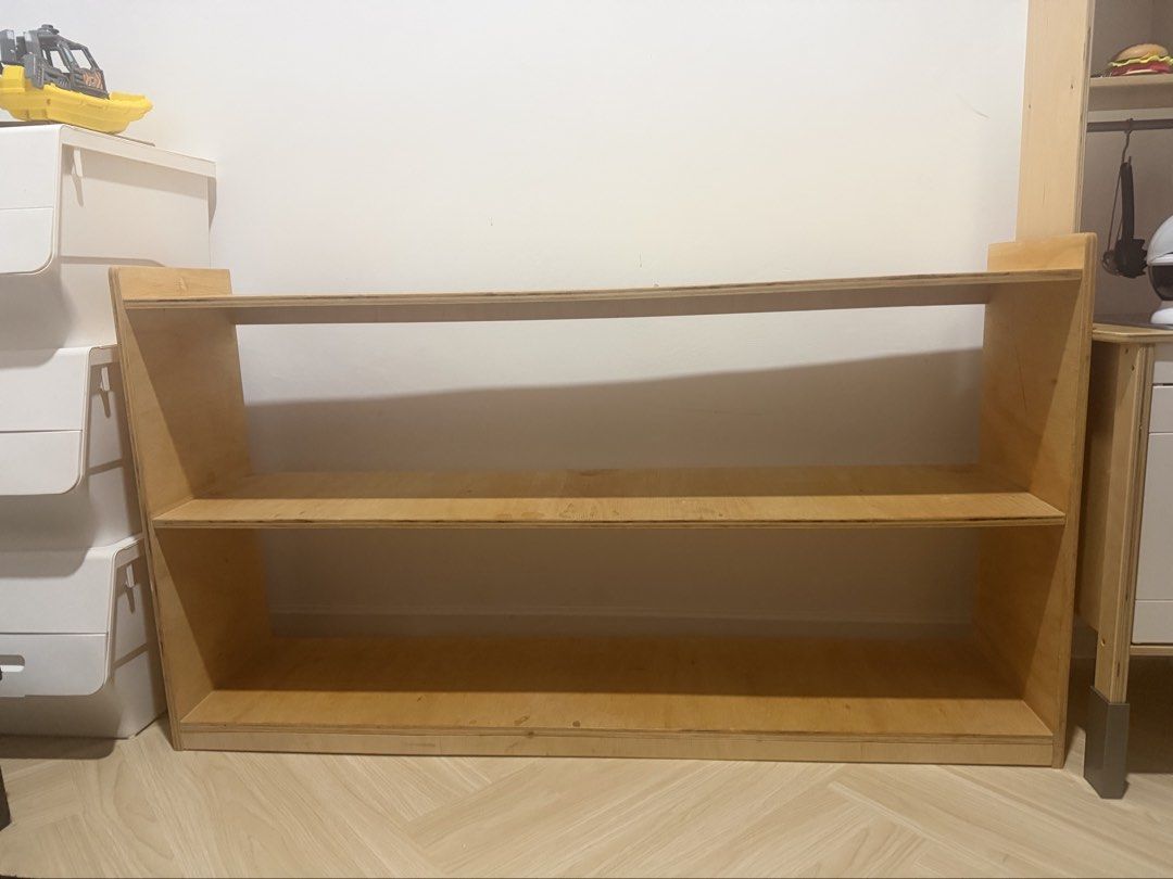 Wooden 2-Tier Bookshelf / Display Shelf Montessori (Category: Shelves, Cabinets & Racks) located in Putrajaya. Submitted by ms.shrfh (Listing ID 1448388716, Image 2). Description: - Simple 2-tier wooden bookshelf - Made of plywood - Ideal for books, toys, or display items - Dimensions: Approx. [width]cm (W) x [height]cm (H) x [depth]cm (D) - Sturdy with minor scuffs from use - Perfect for a child's room or study area.