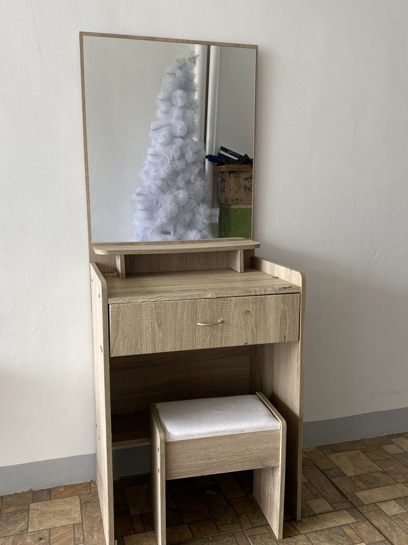 Wooden Dressing Table with Mirror and Stool (Category: Tables & Sets) located in Dasmarinas. Submitted by majoypiol10215 (Listing ID 1448300589, Image 1). Description: * ✔️ Good condition * ✔️ With large mirror * ✔️ With mini chair * ✔️ 1 drawer + storage shelf * ✔️ Fully functional * ✔️ Minimal na tuklap lang dahil sa normal na paggamit (see photos) * ✔️ Malinis at ready to use RFS: Decluttering / Hindi na nagagamit. 📩 PM for interested buyers.