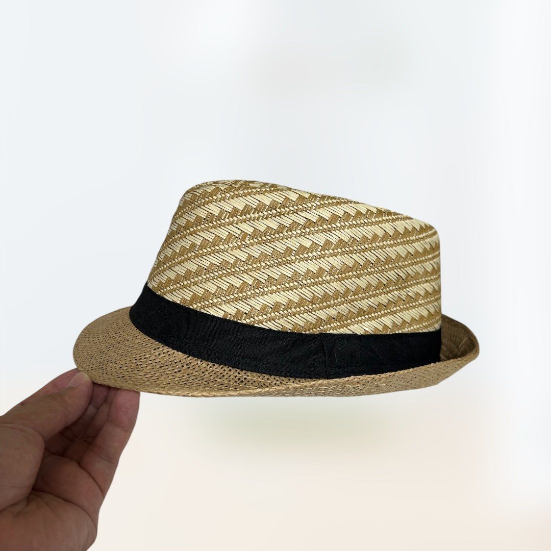 NEW Woven Fedora HAT with Black Band (Category: Caps & Hats) located in Pasig City. Submitted by funhuntr (Listing ID 1448381822, Image 3). Description: NEW UNUSED Woven Raffia Fedora Hat - Stylish woven fedora hat - Tan and beige patterned crown - Classic black band around the base - Ideal for outdoor OOTDs, great for photoshoots and adding flair to outfits, will fir right in for beach and nature trips - One size fits most adults, head opening i