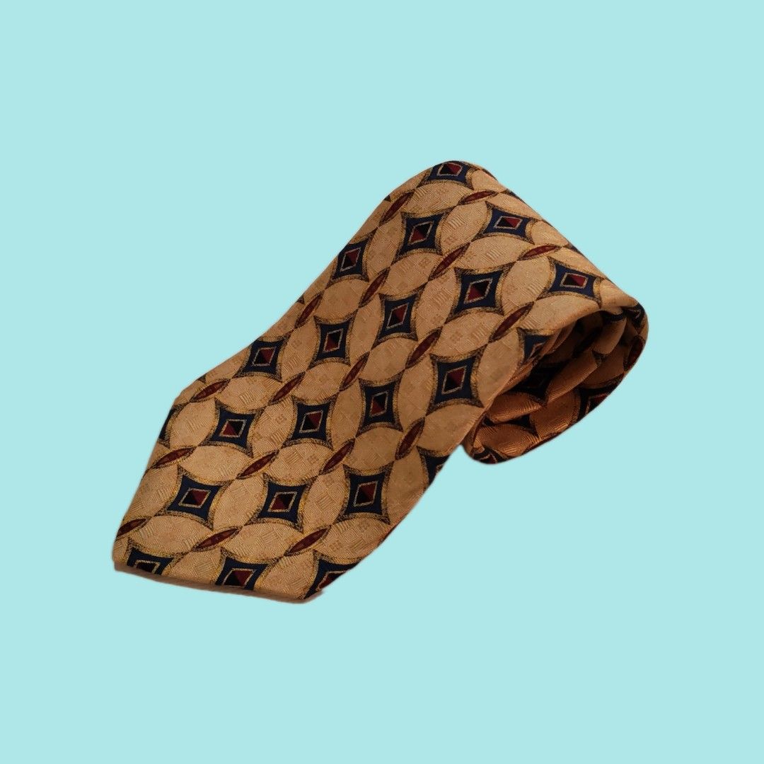 XMI for Nordstrom Silk Tie (Category: Ties) located in Dinalupihan. Submitted by senkustuff (Listing ID 1448373243, Image 1). Description: - Gold tie with a sophisticated geometric pattern. - Features navy blue and burgundy diamond shapes in an oval design. - Hand-sewn quality by XMI for Nordstrom. - An excellent accessory to elevate any formal outfit. - Adds a timeless, classic touch to your ensemble..