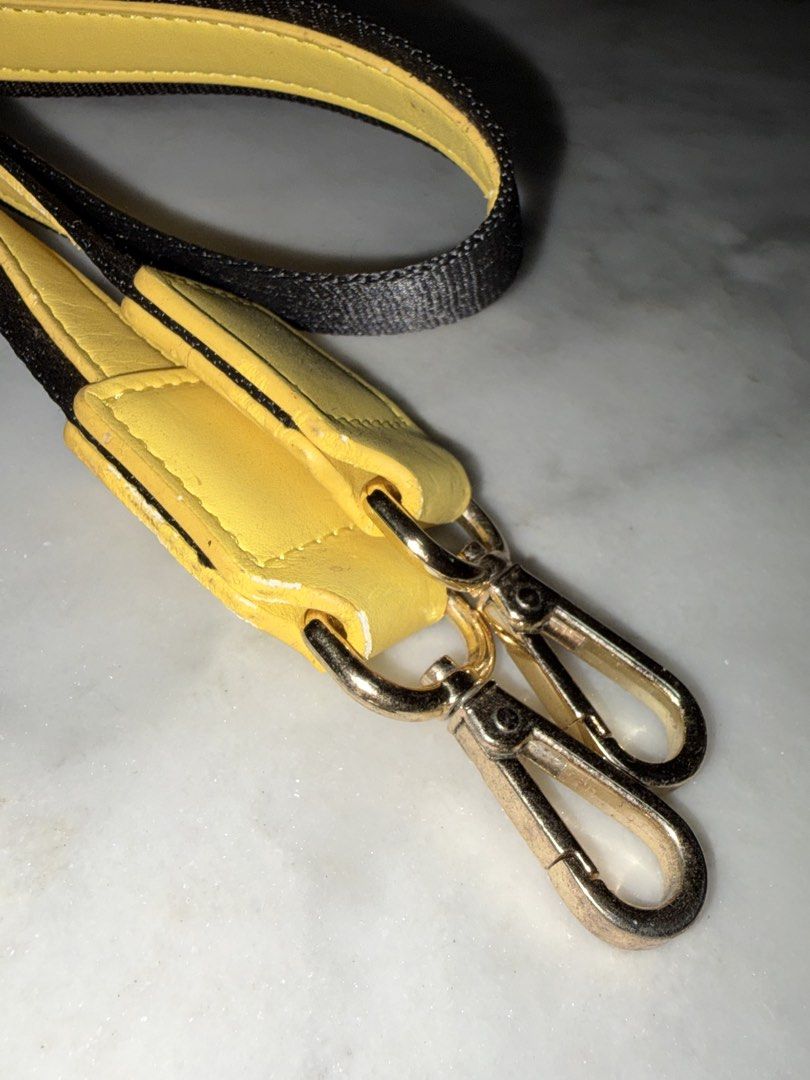 Yellow and Black Bag Strap with Gold Clasps (Category: Cross-body Bags) located in Quezon City. Submitted by EveryWANTShop (Listing ID 1448356264, Image 3). Description: - never been used - Adjustable bag strap - Yellow leather accents - Black woven strap - Gold hardware with two swivel clasps - Perfect for customizing your bags - Shows some signs of wear on the leather.
