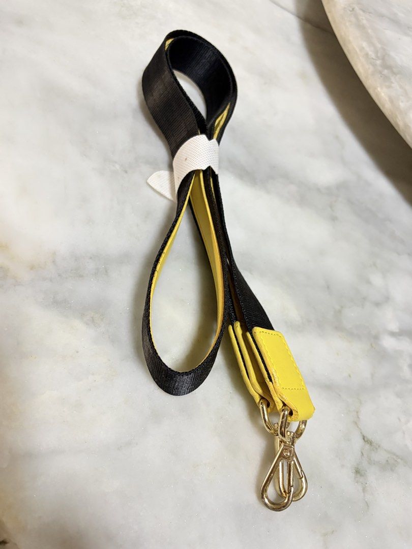 Yellow and Black Bag Strap with Gold Clasps (Category: Cross-body Bags) located in Quezon City. Submitted by EveryWANTShop (Listing ID 1448356264, Image 2). Description: - never been used - Adjustable bag strap - Yellow leather accents - Black woven strap - Gold hardware with two swivel clasps - Perfect for customizing your bags - Shows some signs of wear on the leather.
