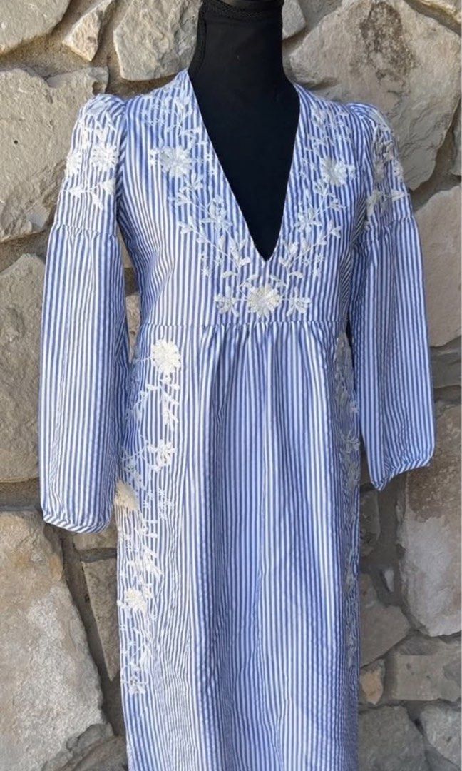 Zara Embroidered Midi Dress (Category: Dresses) located in Quezon City. Submitted by onyx72 (Listing ID 1448319663, Image 3). Description: Zara Embroidered Midi Dress Brandnew with tags Blue & white pinstripe With intricate white floral embroidery along the neckline, shoulders & sides V-neckline with a relaxed loose fit 3/4 length puff sleeves Lightweight cotton blend stripe fabric With side pockets🥰.