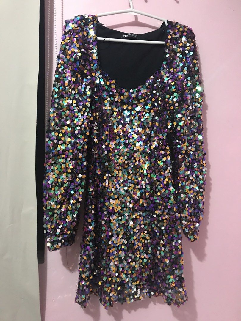 ZARA Sequin Long Sleeve Mini Dress (Category: Dresses) located in Davao. Submitted by jjnvm (Listing ID 1448341465, Image 1). Description: - Used Once - ZARA Sparkly Sequin Mini Dress - Size: XS - Features: Long sleeves, sweetheart neckline - Design: Fun, colorful sequins all over - Occasion: Ideal for parties or a night out - Origin: Made in China.