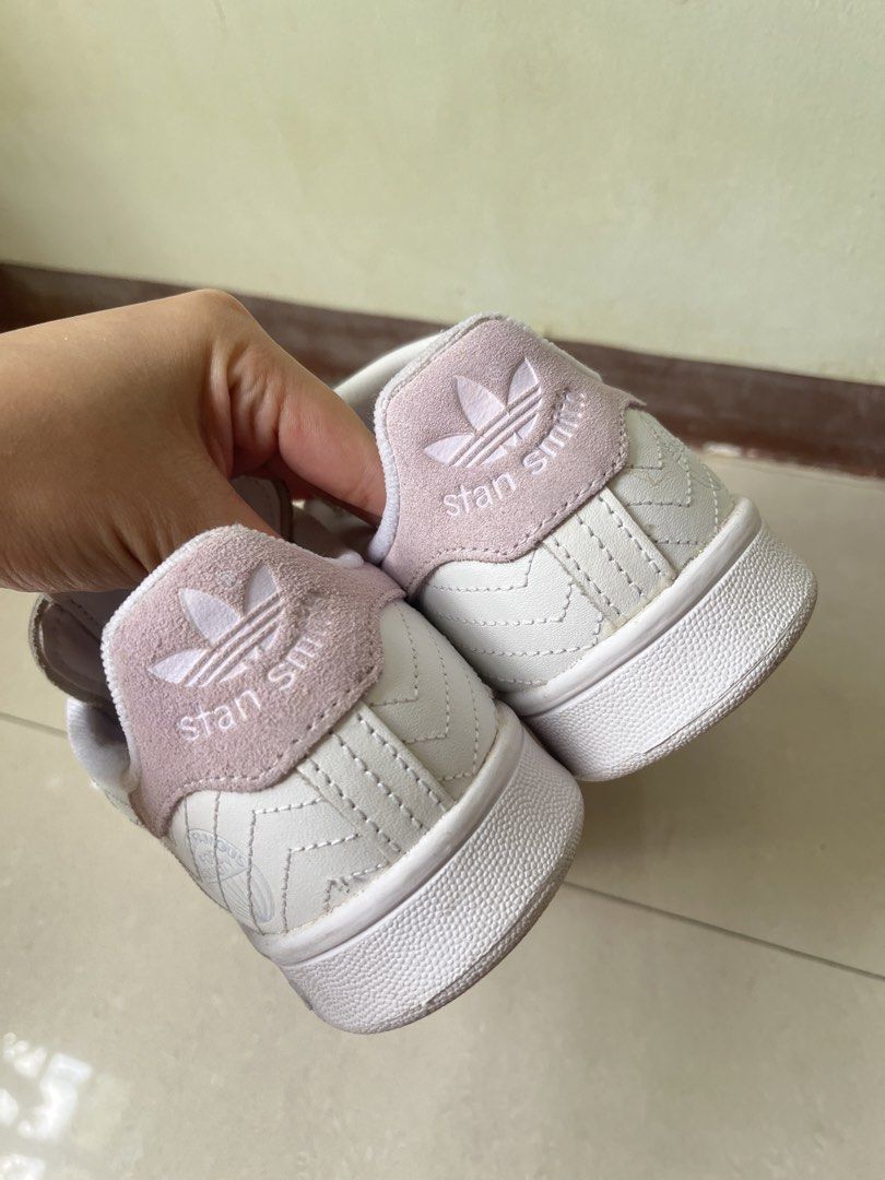 Adidas Stan Smith White Pink Leather Sneakers (Category: Sneakers) located in Manila. Submitted by graceeeeee_ (Listing ID 1448536025, Image 1). Description: - White Adidas Stan Smith sneakers - Pink accent details - Unique stitched pattern on leather - Lace-up closure - Comfortable for everyday wear - Size: 4 UK / 5.5 US.