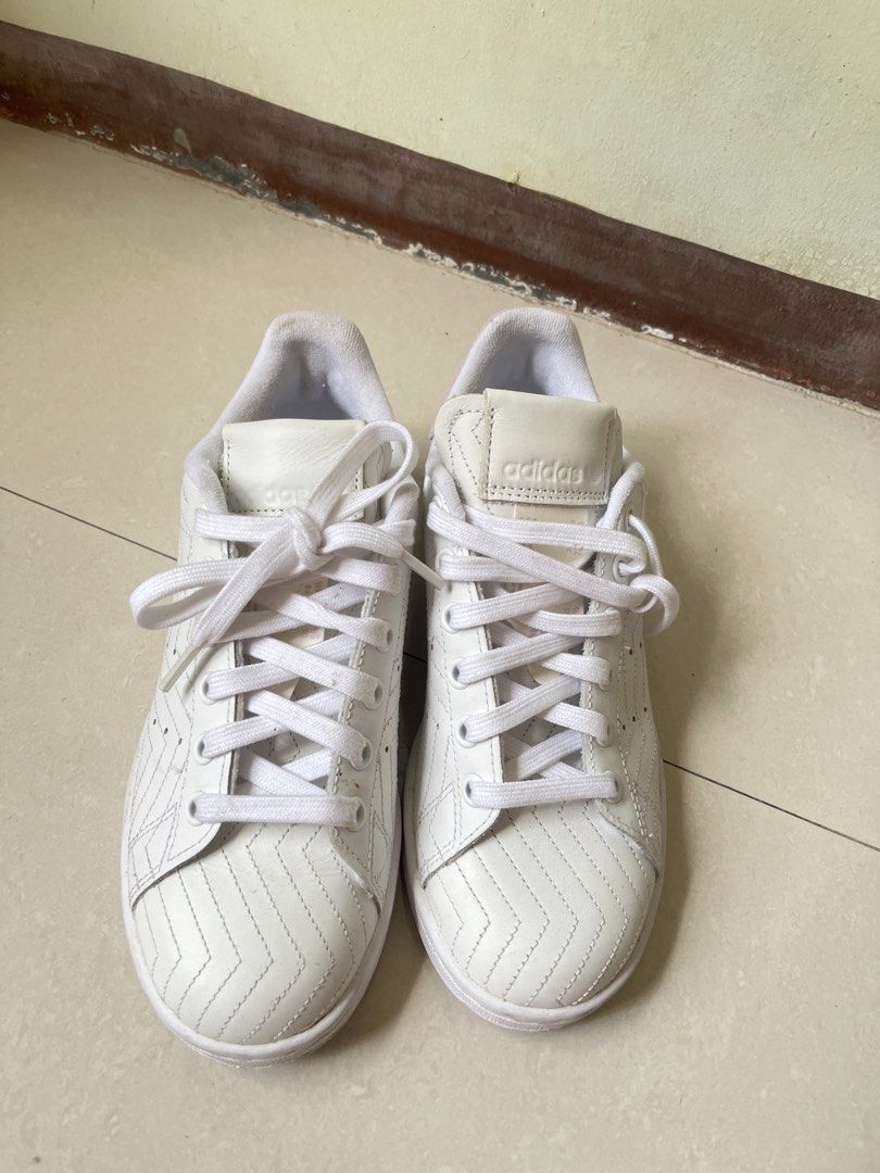 Adidas Stan Smith White Pink Leather Sneakers (Category: Sneakers) located in Manila. Submitted by graceeeeee_ (Listing ID 1448536025, Image 2). Description: - White Adidas Stan Smith sneakers - Pink accent details - Unique stitched pattern on leather - Lace-up closure - Comfortable for everyday wear - Size: 4 UK / 5.5 US.