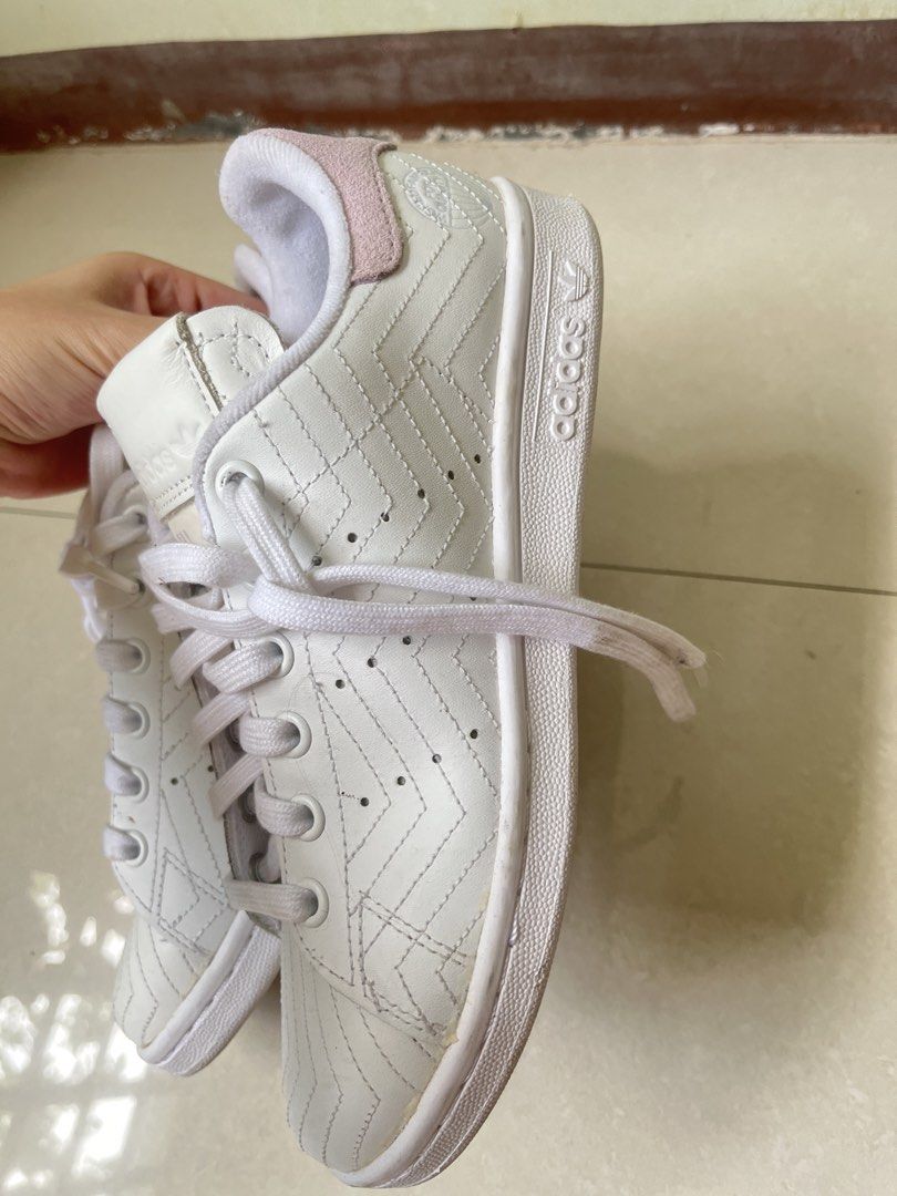 Adidas Stan Smith White Pink Leather Sneakers (Category: Sneakers) located in Manila. Submitted by graceeeeee_ (Listing ID 1448536025, Image 3). Description: - White Adidas Stan Smith sneakers - Pink accent details - Unique stitched pattern on leather - Lace-up closure - Comfortable for everyday wear - Size: 4 UK / 5.5 US.