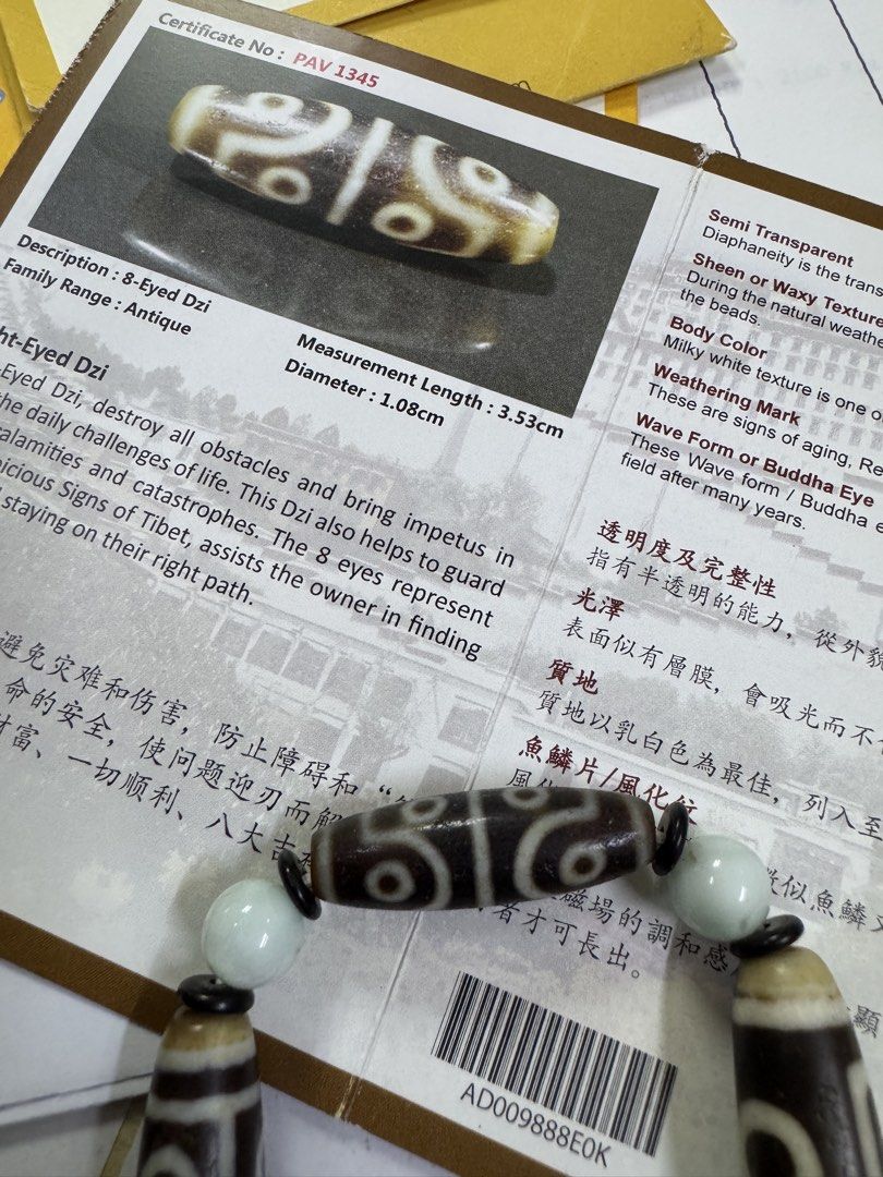 Antique 8-Eyed Dzi Bead Bracelet with Certificate (Category: Bracelets) located in Kuala Lumpur. Submitted by kilx167 (Listing ID 1448608046, Image 1). Description: - Antique 8-Eyed Dzi bead bracelet - Includes Certificate PAV 1345 - Believed to destroy obstacles and bring impetus - Guards against calamities and catastrophes - Bead dimensions: 3.53cm (length) x 1.08cm (diameter) - Features a milky white texture with signs of aging.