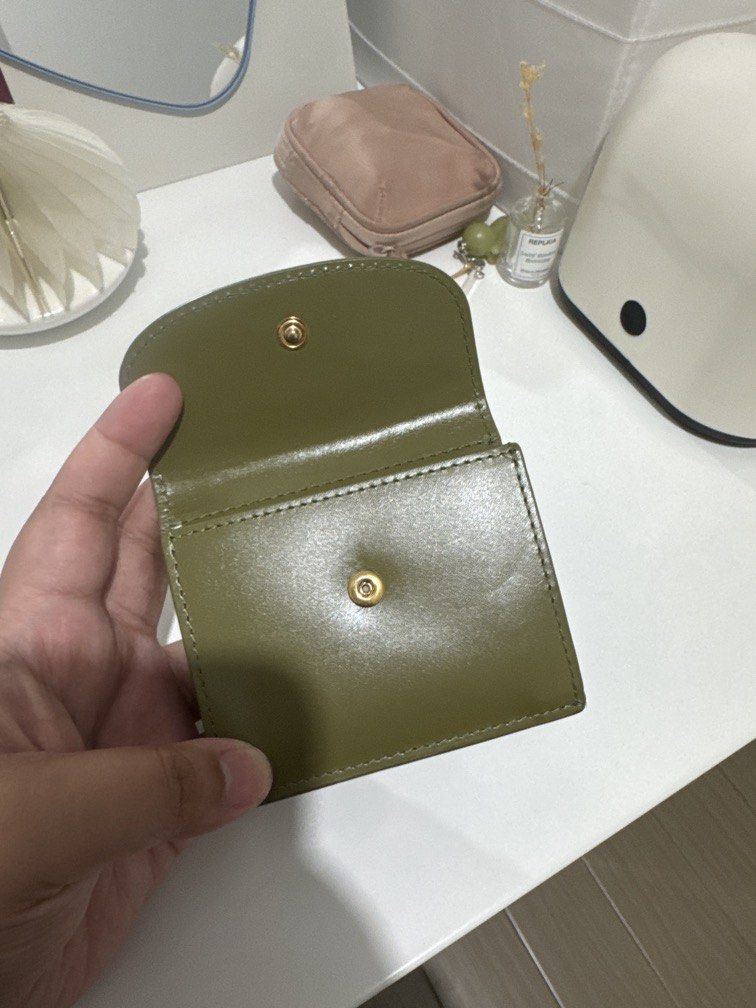 A.P.C. Geneve Trifold Wallet in Olive (Category: Wallets & Card holders) located in Taguig. Submitted by blessthismessph (Listing ID 1440497638, Image 3). Description: - Olive green trifold wallet - Brand: A.P.C. - Made in France - Embossed A.P.C. logo on front flap - Compact size, perfect for essentials - Material: Leather - Clean and simple design Actual photos available upon request, dust pouch included. Retails 14K, slightly negotiable but no