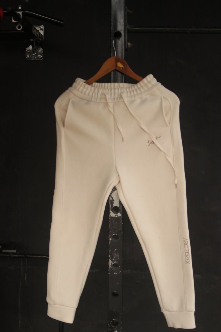Arc'teryx Cream Sweatpants S (Category: Joggers) located in Taguig. Submitted by kurim4w (Listing ID 1448566286, Image 1). Description: - Brand: Arc'teryx - Color: Cream - Features iconic embroidered logo on left thigh - Branding detail down the right leg - Elastic waistband with adjustable drawstring - Ribbed cuffs for a snug fit - Comfortable and stylish for everyday wear 28-32 waist 35.5" length 5" hem.