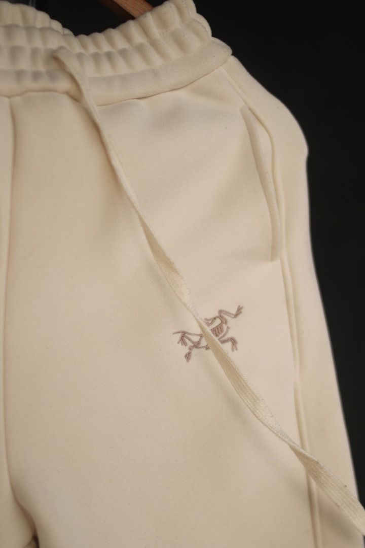 Arc'teryx Cream Sweatpants S (Category: Joggers) located in Taguig. Submitted by kurim4w (Listing ID 1448566286, Image 2). Description: - Brand: Arc'teryx - Color: Cream - Features iconic embroidered logo on left thigh - Branding detail down the right leg - Elastic waistband with adjustable drawstring - Ribbed cuffs for a snug fit - Comfortable and stylish for everyday wear 28-32 waist 35.5" length 5" hem.