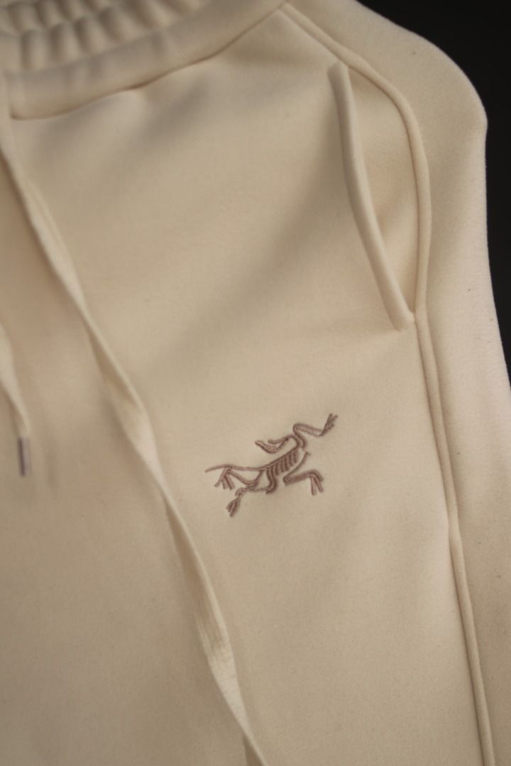 Arc'teryx Cream Sweatpants S (Category: Joggers) located in Taguig. Submitted by kurim4w (Listing ID 1448566286, Image 3). Description: - Brand: Arc'teryx - Color: Cream - Features iconic embroidered logo on left thigh - Branding detail down the right leg - Elastic waistband with adjustable drawstring - Ribbed cuffs for a snug fit - Comfortable and stylish for everyday wear 28-32 waist 35.5" length 5" hem.