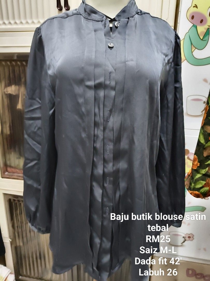 Baju Butik Satin Blouse (Category: Blouses) located in Kuala Lumpur. Submitted by famnastore (Listing ID 1448677742, Image 1). Description: Material satin berat jatuh terletak bila pakai Baju blouse butik. NP RM99 - Elegant grey satin blouse - Thick, quality material - Button-up front with stylish pleat details - Long sleeves with comfortable elastic cuffs - Fits M-L sizes (Chest: 42 inches, Length: 26 inches) - Perfect for both casual outings an