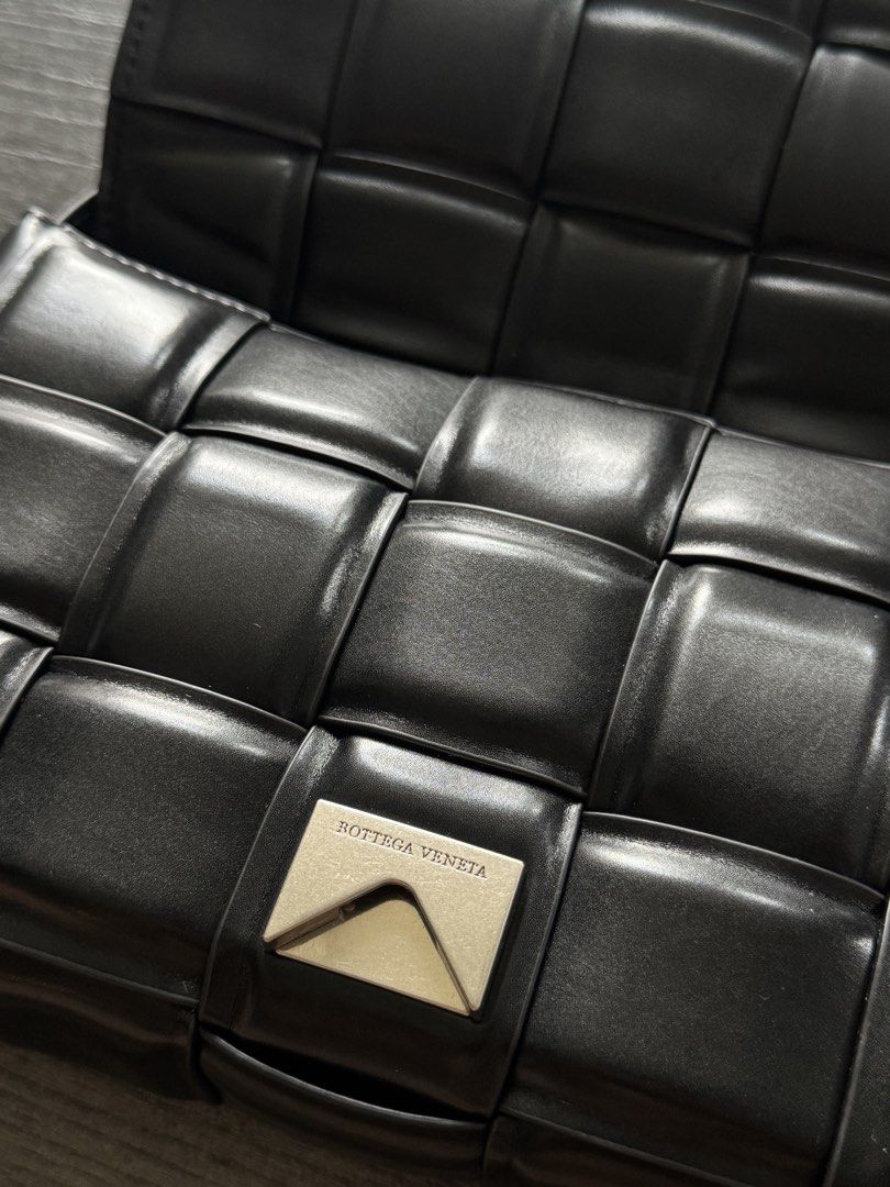 Bottega Veneta Padded Cassette Bag (Category: Sling Bags) located in Quezon City. Submitted by drizzyarchives (Listing ID 1448539334, Image 3). Description: Pre Loved Bottega Veneta Padded Cassette Bag • Black Exterior & Interior 🖤 • Super pristine condition 10/10 (Rank A) 🙌 • Complete Originality Certified Tag ✅ • Serial code ✅ • No issues 💯 • Adjustable Strap ✅ • Silver Buckle 🩶 • Good everyday bag 🧳 Price + SF (same day delivery) ❗️NO LOW