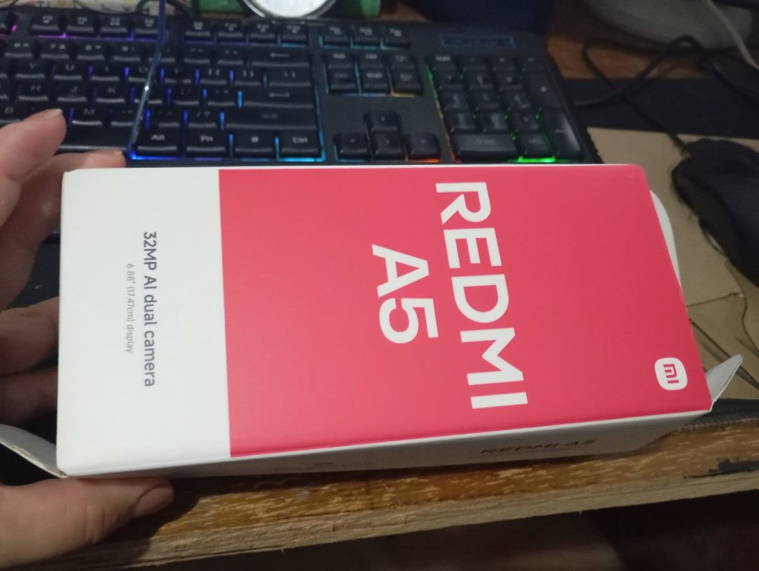 Brand New Xiaomi REDMi A5 (Category: Xiaomi) located in Antipolo. Submitted by olxph_133872565 (Listing ID 1447803347, Image 2). Description: Key SpecificationsDisplay: 6.88-inch HD+ Dot Drop Display (1640 x 720 pixels) with up to 120Hz refresh rateProcessor: UNISOC T7250 (12nm, octa-core up to 1.8GHz)RAM & Storage: 3GB/64GB and 4GB/128GB (supports expandable RAM/Memory Extension)Cameras: 32MP main camera + 8MP front cameraBattery: 5200mAh capaci