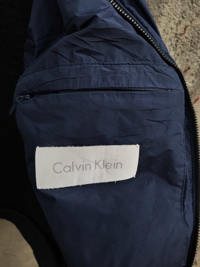 Calvin Klein 2 way color jacket (Category: Coats, Jackets and Outerwear) located in Bulacan. Submitted by rage_against_stitches.ph (Listing ID 1448648669, Image 2). Description: L 25.5 W 20 excellent condition Riri Underzip.