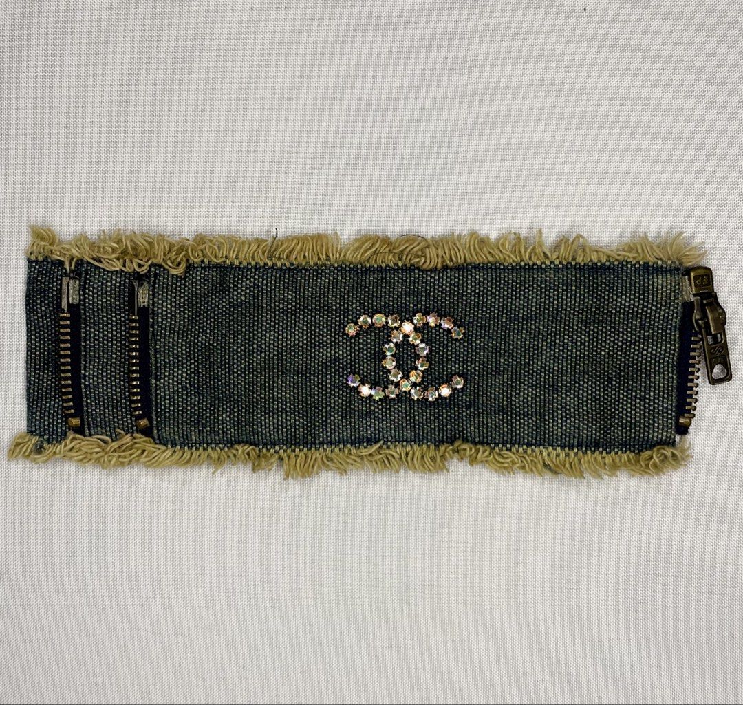 Chanel 01P denim cuff bracelet (Category: Luxury Accessories) located in San Fernando. Submitted by larchivefeminine (Listing ID 1448653917, Image 1). Description: -Chanel 2001 Spring/Summer (01P) collection -blue denim fabric -rhinestone-encrusted CC logo.