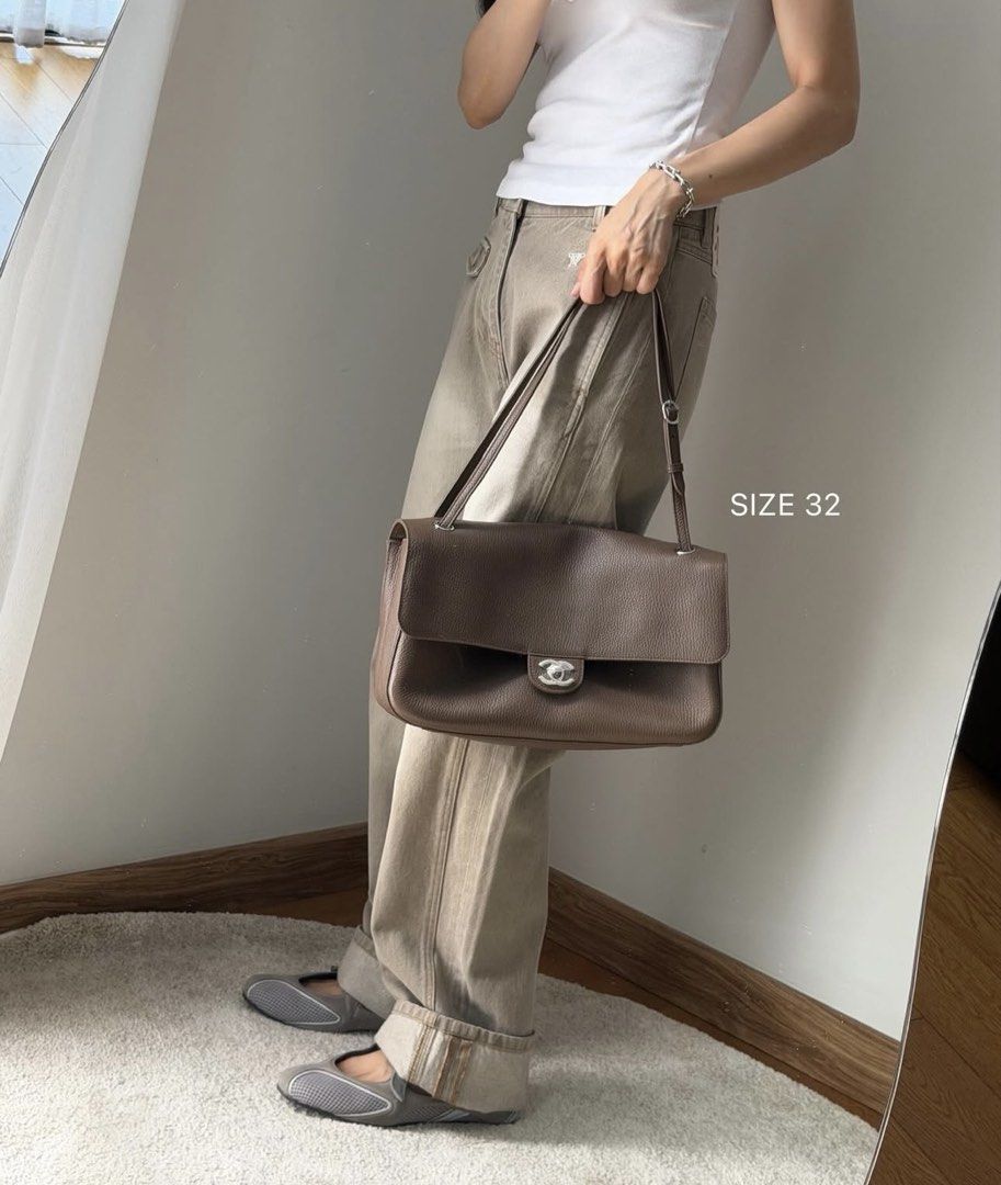 Chanel Maxi Flap taupe (Category: Luxury Bags & Wallets) located in Silang. Submitted by girlyouneedthis (Listing ID 1448519205, Image 2). Description: Flash sale today only. Chanel maxi flap in this beautiful grained taupe leather. Microchipped, comes with dustbag only: No returns, No exchange, No refunds..