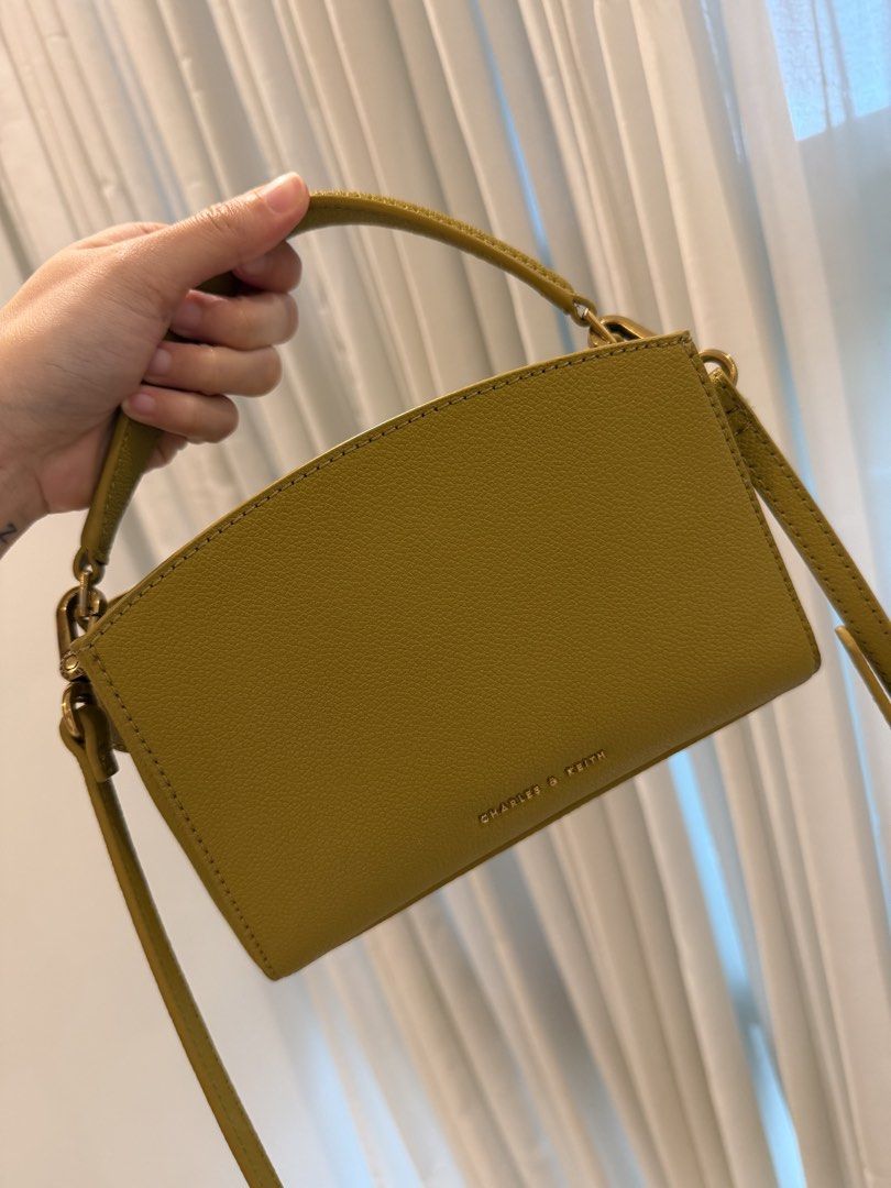 Charles & Keith Olive Bag 🫒 (Category: Cross-body Bags) located in Cebu City. Submitted by itemsbysarah (Listing ID 1448582837, Image 2). Description: Charles & Keith Olive Crossbody Bag Used a few times, good as new Hardware 8/10 minimal tarnishing Clean interior No scratches on the leather RFS: decluttering ❕Low ballers will not be entertained ❕ .