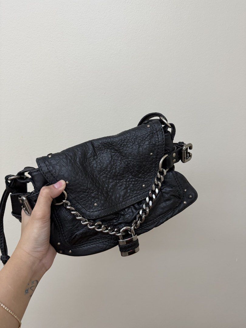 Chloe Black Leather Studded Shoulder Bag with Lock (Category: Luxury Bags & Wallets) located in Manila. Submitted by tashvintagefinds (Listing ID 1448620170, Image 3). Description: - Authentic Chloe Paddington Capsule - Black (recolored from metallic silver) - With signs of usage - Last price posted.