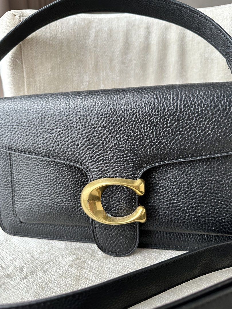 Coach Tabby Shoulder Bag 26 Black Pebble Leather (Category: Shoulder Bags) located in Caloocan City. Submitted by mkcn__ (Listing ID 1448540079, Image 2). Description: Black pebble leather - PRISTINE condition Brass hardware - with flaws (see pictures) Comes with a detachable crossbody strap - never used the strap but since I kept it inside the drawer, the leather is not in good condition.
