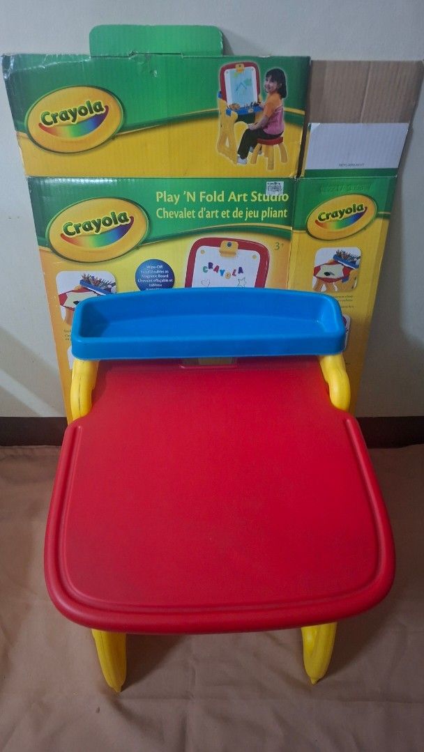 Crayola Play 'N Fold Art Studio Easel (Category: Art & Prints) located in Quezon City. Submitted by declutterseoul (Listing ID 1448521867, Image 2). Description: - SELLING with box - with minimal flaw on the white board - NO CHAIR INCLUDED - Crayola art easel perfect for young artists. - Folds flat for convenient storage. - Features a drawing surface. - Includes a tray to hold art supplies. - Comes with the original box..