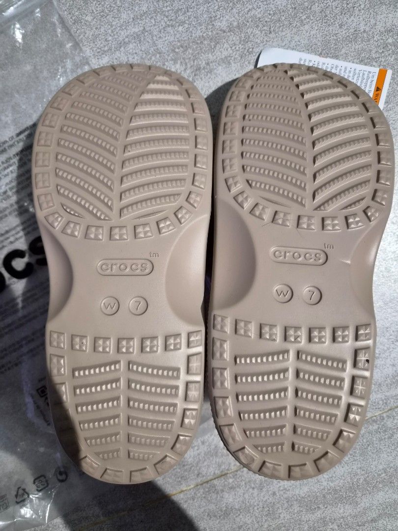Crocs Beige Double Strap Slides Sandals Size 7 (Category: Flats & Sandals) located in Taguig. Submitted by orange_potion (Listing ID 1448606153, Image 3). Description: - Beige Crocs slides - Women's size 7 - Double strap design with adjustable buckles - Brand new with original tags attached - Comes in original plastic bag - Ideal for casual outings or lounging at home.