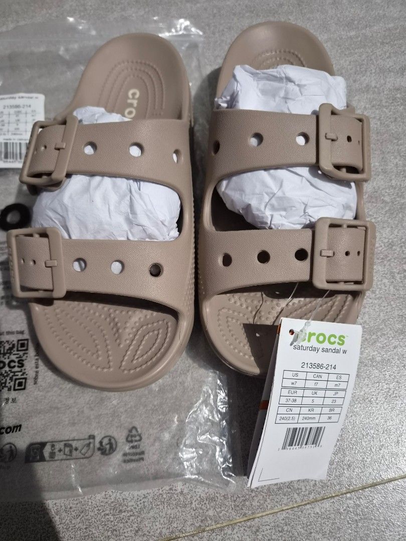 Crocs Beige Double Strap Slides Sandals Size 7 (Category: Flats & Sandals) located in Taguig. Submitted by orange_potion (Listing ID 1448606153, Image 2). Description: - Beige Crocs slides - Women's size 7 - Double strap design with adjustable buckles - Brand new with original tags attached - Comes in original plastic bag - Ideal for casual outings or lounging at home.