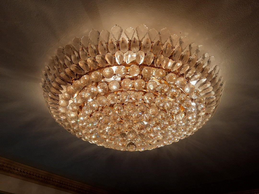 Crystal Chandelier Ceiling Light Fixture (Category: Lighting) located in Manila. Submitted by epictree.a37e8d (Listing ID 1448642679, Image 2). Description: - Beautiful crystal chandelier - Features sparkly glass beads and teardrop crystals - Emits a warm, inviting glow when lit - Adds a touch of glamour to any space - Perfect for living rooms or dining areas - Reason for selling: Redecorating.