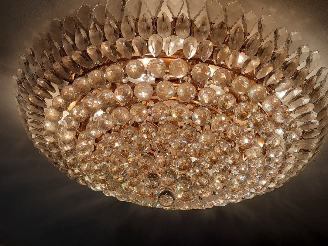 Crystal Chandelier Ceiling Light Fixture (Category: Lighting) located in Manila. Submitted by epictree.a37e8d (Listing ID 1448642679, Image 1). Description: - Beautiful crystal chandelier - Features sparkly glass beads and teardrop crystals - Emits a warm, inviting glow when lit - Adds a touch of glamour to any space - Perfect for living rooms or dining areas - Reason for selling: Redecorating.