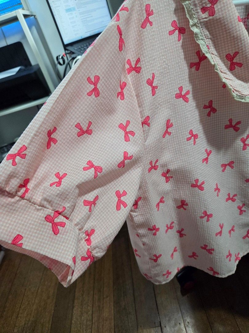 Cute Pink Ribbon Top from BKK (Plus Size) (Category: Blouses) located in Quezon City. Submitted by panchie32 (Listing ID 1448641914, Image 2). Description: * Worn only once – still in excellent condition! Details: ✔️ Bought from Bangkok ✔️ Cute pink ribbon design ✔️ About 3/4 sleeves ✔️ Best fit for 2XL–4XL plus-size girlies * I usually wear 3XL, and this fits me a bit loose 📍 Location: Brgy. Kaligayahan, Novaliches, Quezon City Shipping & Payme