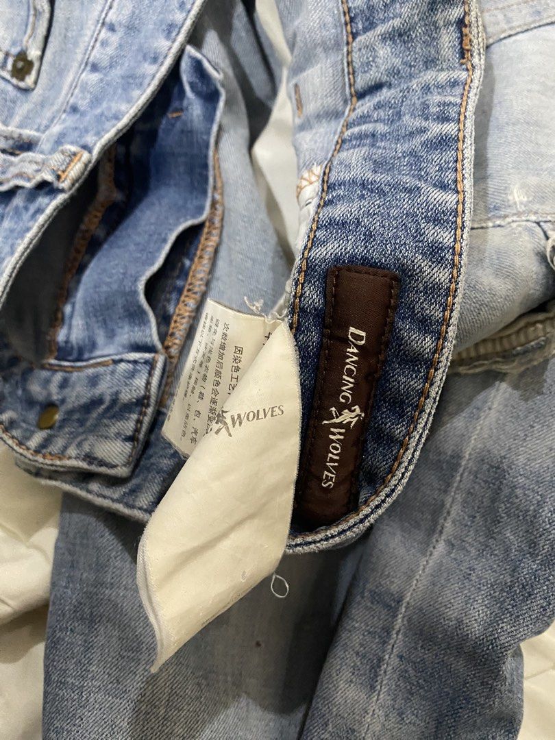 Dancing Holves Light Wash Distressed Denim Jeans (Category: Jeans) located in Naga. Submitted by clidtw (Listing ID 1448529563, Image 2). Description: - Light wash denim jeans - Distressed details on the front - Straight leg fit - Button and zip closure - Front and back pockets - Perfect for casual wear.