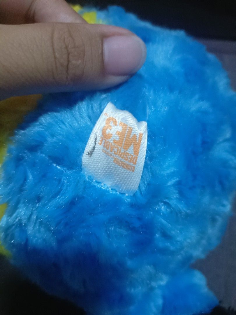 Despicable Me 3 Minion Plush Toy (Category: Plushies & Soft Toys) located in Taal. Submitted by zildreiven (Listing ID 1448568262, Image 2). Description: - Cute Minion plush toy from Despicable Me 3 - Soft and fluffy yellow body - Wears iconic blue overalls - Features one green eye and one brown eye - Perfect for Despicable Me fans - Ideal for cuddling or as a display piece.