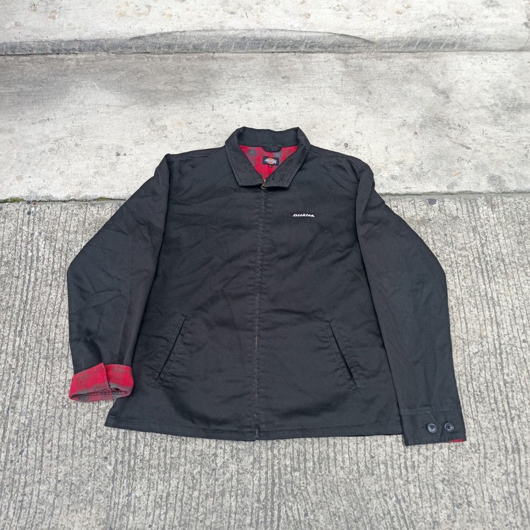Dickies Black Harrington Jacket Red Plaid Lining (Category: Coats, Jackets and Outerwear) located in Manila. Submitted by dhaejess23344 (Listing ID 1448554893, Image 1). Description: - Classic black Dickies jacket - Red plaid lining for a pop of color - Two front pockets - Button closure on cuffs - Great for layering - Simple and durable design W22.5xL26.5.