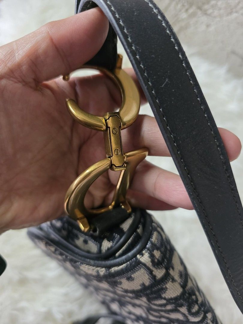 Dior Saddle Bag Oblique Canvas Navy Gold Hardware (Category: Luxury Bags & Wallets) located in Batangas. Submitted by venus232nd (Listing ID 1448597468, Image 3). Description: - Dior Saddle Bag - Iconic Oblique monogram canvas - Gold-tone hardware with 'D' charm & 'CD' accents - Genuine leather strap and trim - Interior pocket - Timeless and classic design.
