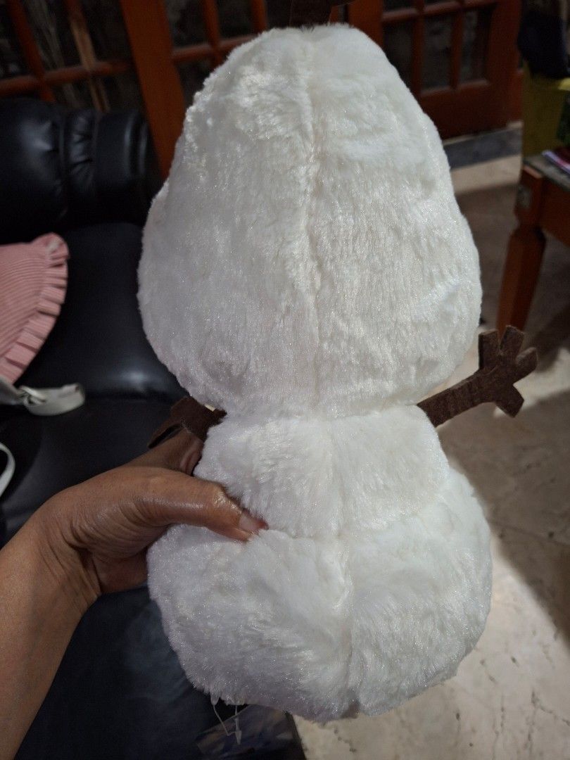 Disney Frozen Olaf Plush Toy (Category: Plushies & Soft Toys) located in Quezon City. Submitted by pure_trinsky (Listing ID 1448532241, Image 2). Description: - Adorable Olaf plush toy from Disney's Frozen - Super soft and cuddly, perfect for hugs! - Features his iconic carrot nose and twig arms - Great for playtime, collecting, or room decor - Approximately 14 inches in length.