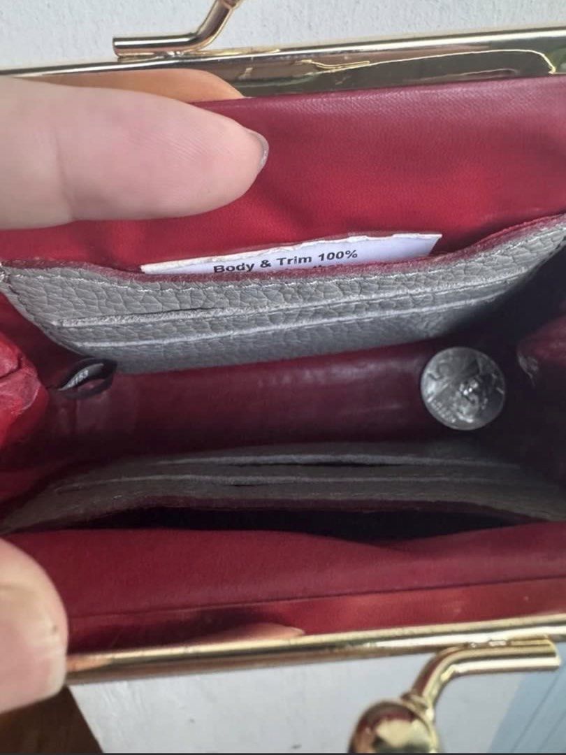 Dooney & Bourke Grey Leather Coin Purse (Category: Wallets & Card holders) located in Binangonan. Submitted by joizeeful (Listing ID 1448646307, Image 3). Description: - Authentic Dooney & Bourke coin purse - Grey pebbled leather exterior - Gold-tone kiss clasp closure - Red interior with card slots - Made with 100% leather (body & trim) - Small and compact, ideal for essentials.