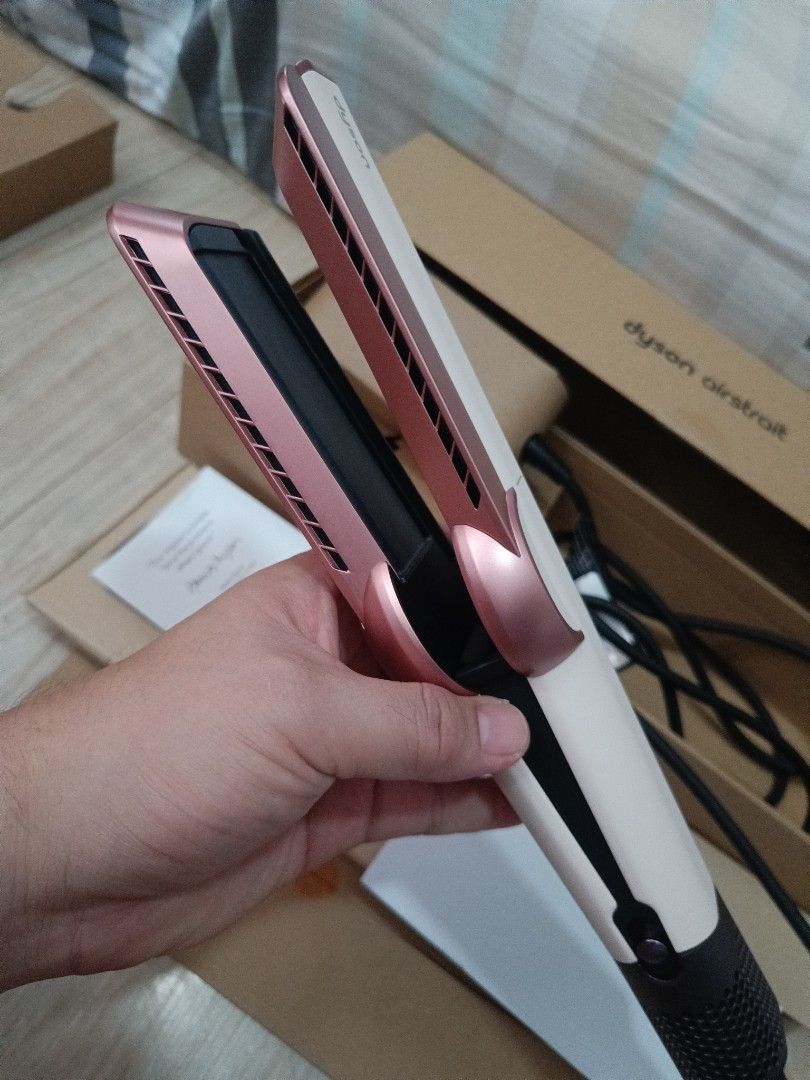 Dyson Airstrait Straightener Rose Gold (Category: Hair) located in Manila. Submitted by naldsais.ron (Listing ID 1448487733, Image 3). Description: My wife is selling her Dyson airstrait - complete - used it only twice - complete with box features: - Dyson Airstrait Hair Straightener - Stunning Rose Gold color - Versatile: Works on both wet and dry hair - Corded electric power - Comes with original box and manual - Ideal for quick and effortless 