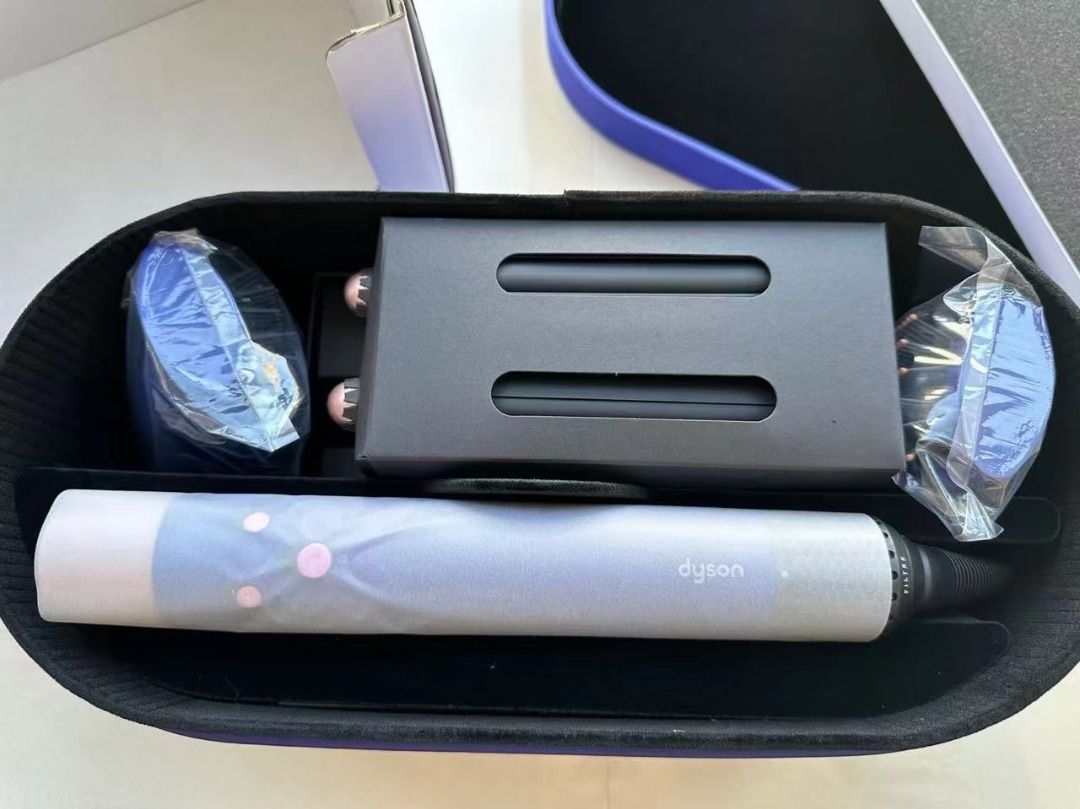 Dyson Airwrap Complete Styler Set (Category: Hair) located in Muntinlupa City. Submitted by fuzetarhub95690 (Listing ID 1448559546, Image 2). Description: - Dyson Airwrap Complete set - Includes main styler unit, various barrels, and brush attachments - All pieces fit neatly into the storage case - Comes with a black storage pouch - Ideal for achieving various hairstyles with ease.