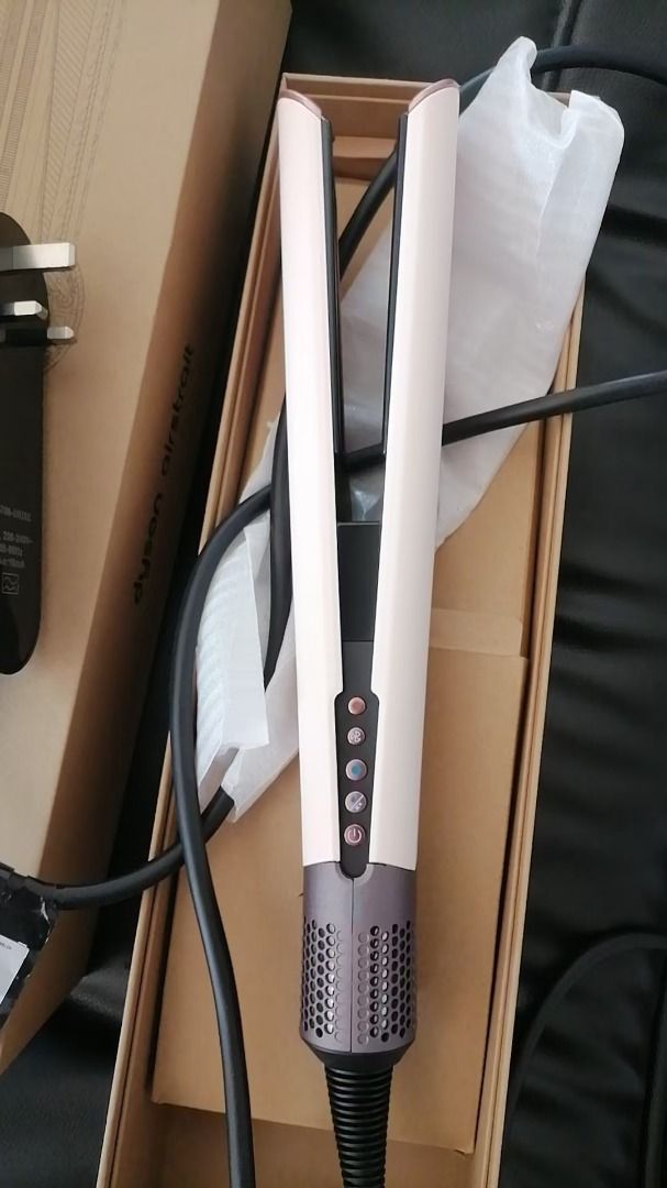 Dyson Airwrap Styler - Pink & Rose Gold (Category: Hair) located in Pateros City. Submitted by nisfarxald25135 (Listing ID 1448490325, Image 1). Description: - Dyson Airwrap styler in stylish pink and rose gold. - Includes charging cord and plug. - Original box included. - Achieve beautiful hairstyles with ease..