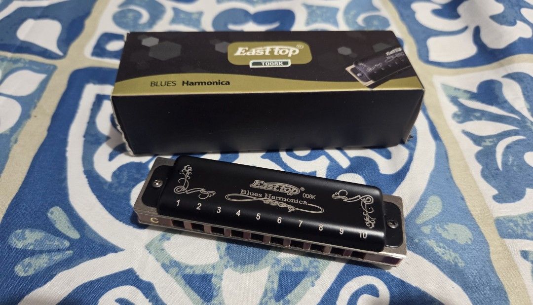 Easttop Blues Harmonica T008K in C (Category: Musical Instruments) located in Dasmarinas. Submitted by youngdeer-bdc6 (Listing ID 1448600389, Image 2). Description: Selling my Easttop 008K Blues Harmonica in Key of C. - Ideal for beginners and experienced players. - Easy to play with a pleasant sound - Comes with protective case and original box. - Already sanitized with alcohol and air dry to remove any previous use, no smell. Issues: None, 9/10