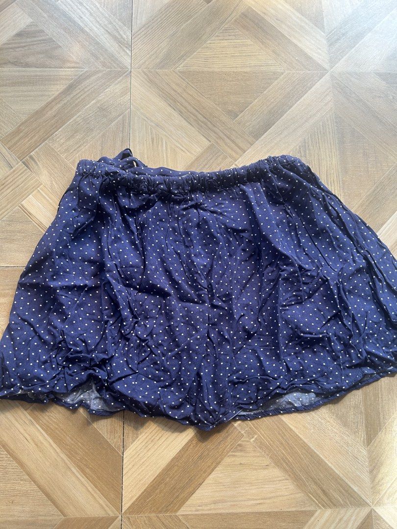 Forever 21 Navy Blue Polka Dot Ruffle Skirt (Category: Skirts) located in Calbayog City. Submitted by prishhhh (Listing ID 1448675832, Image 3). Description: - Adorable navy blue skirt with charming white polka dots. - Features playful ruffle details all over. - Includes a cute side tie with a flower accent. - Comfortable elastic waistband for a perfect fit. - Ideal for casual wear and everyday style. - Never been used.
